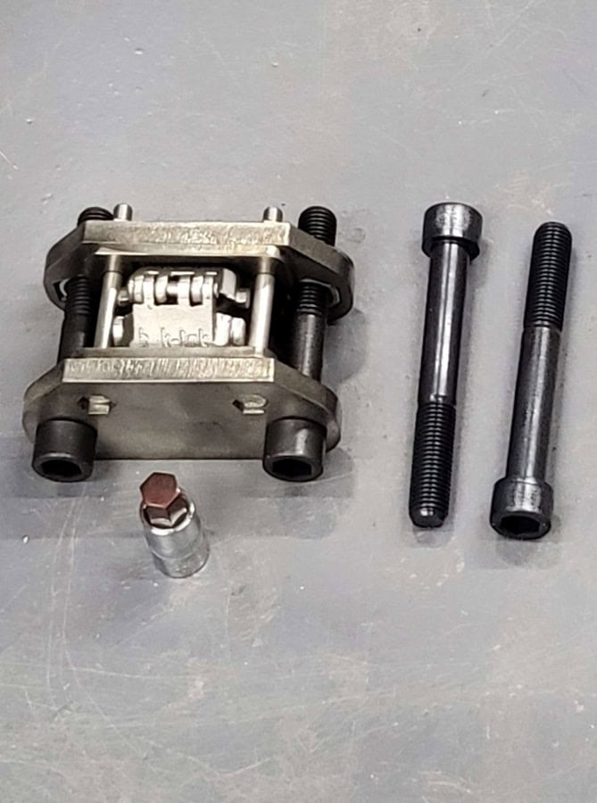 High-performance bicycle derailleur component with bolts for cycling or triathlon bike maintenance and upgrades. Essential for optimizing gear shifting during triathlon training and races.