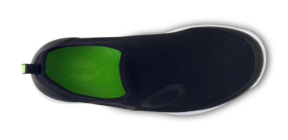 Breathable black and green triathlon shoe designed for cycling and running, featuring quick-dry material and superior grip for optimal performance.