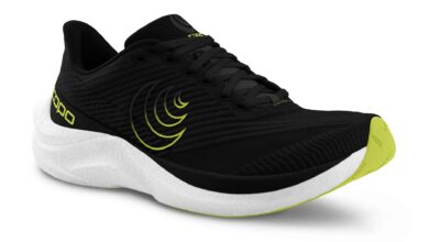Lightweight black and neon yellow triathlon running shoe with breathable mesh, cushioned sole, and strategic grip designed for optimal performance in triathlon training and races.
