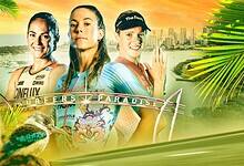 Female triathlon athletes preparing for race at sunset with city skyline in background, showcasing endurance and determination.