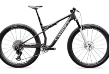A mountain bike designed for off-road cycling, featuring a durable frame, wide knobby tires, and advanced suspension system for rugged terrain. Perfect for triathlon training and outdoor adventures.