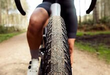 Panaracer GravelKing ZX tire on a gravel bike, designed for high-speed performance on mixed terrain, showcasing durability and grip for gravel and off-road cycling.