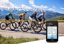 Garmin Edge 1060 displaying a pothole alert beside a group of road cyclists.
