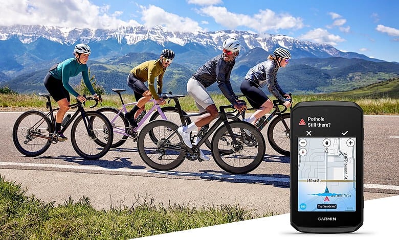 Garmin Edge 1060 displaying a pothole alert beside a group of road cyclists.