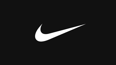 Close-up of the Nike swoosh logo on a black background, representing sportswear and athletic performance.