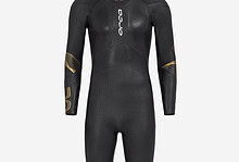 High-performance Orca triathlon wetsuit designed for men, featuring a sleek black and gold design for optimal swimming efficiency and comfort.