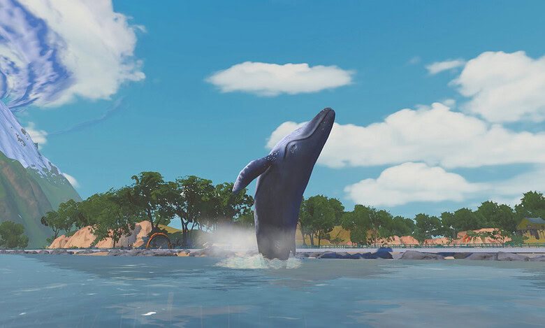 A whale breaches beside the virtual coastline in Zwift’s Wild Isles expansion.